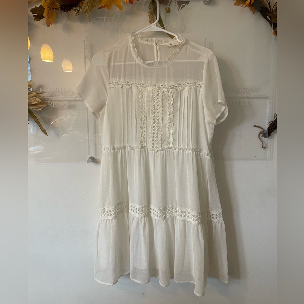 White mini dress with lace pattern